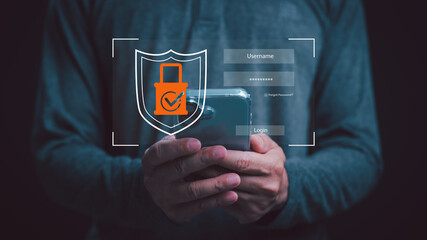 Advanced mobile security concept with smartphone login shield. Man holding phone for biometric data authentication and user privacy protection in digital cloud computing and cyber threat safety.