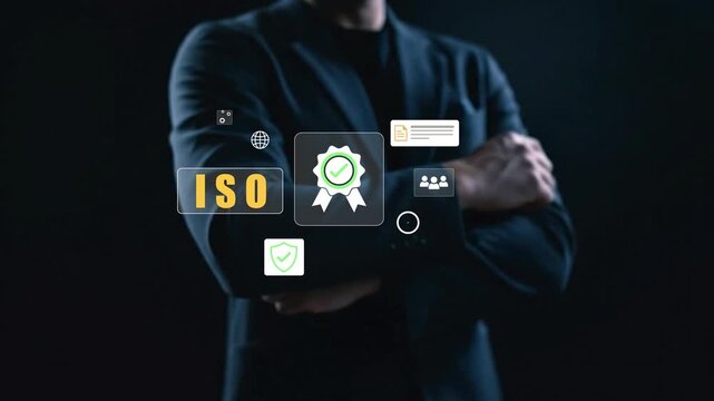 4k, ISO certification and quality management concept. Business professional reviewing ISO certification standards with digital icons representing quality control, management, and compliance processes 