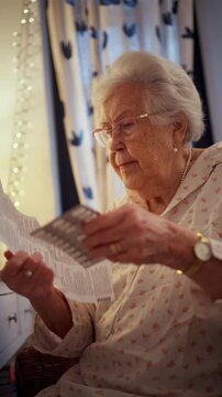 Senior woman taking prescribed pills after waking up.