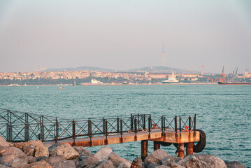 Waterfront pier with city skyline across the Bosphorus in Istanbul