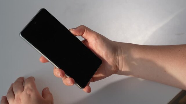 Phone used on a white table