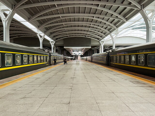 The green train, China Railway, is parked at the platform