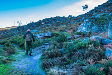 Obraz premium Man walks on a mountain trail
