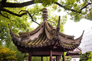 Traditional chinese architecture among trees of Yu garden in Shanghai, China