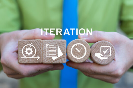 Business person holding wooden blocks with icons sees the text ITERATION. Iteration Process Agile Cycle Development Operations Technology. Business planning and time to iteration 4 concept.