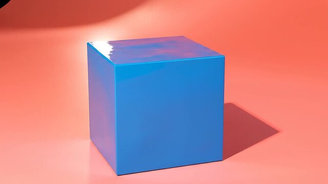 A vibrant blue cube sits against a peachy coral background, with a soft shadow