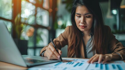 Fototapeta premium Woman analyzing business documents