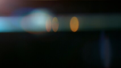 Fototapeta premium Real Lens Flare Reflections for Overlay or Transition Isolated on Black Background