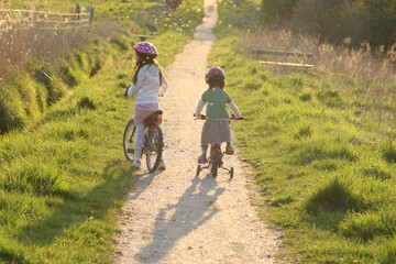 Fototapeta premium 2 Children in bikes on a path in nature in Denmark
