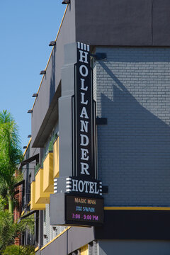 Hollander Hotel Vertical Sign On Modern Grey Brick Building With Neon Message Board. Editorial Use Only Jan 23, 2026 St. Petersburg, FL USA. Exterior view of the Hollander Hotel featuring a tall verti