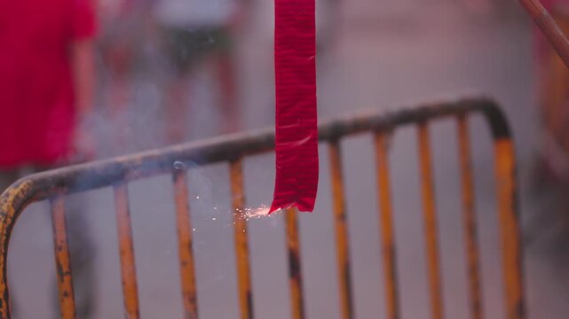 Traditional chinese firecrackers are exploding with flashes and smoke in Lunar new year.