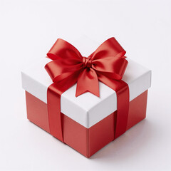 Obraz premium A red-ribboned Christmas gift box, top view, isolated on a white background