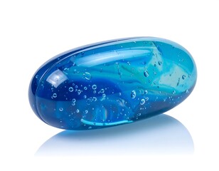 A close-up studio shot showcases a translucent, oblong-shaped object with internal swirls of blue hues and bubbles, set against a white backdrop with a reflection