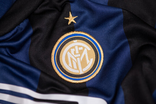 Close-up of Inter Milan football club crest embroidered on blue and black jersey fabric, symbol of Italian soccer tradition and sports identity.