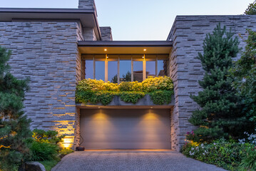 Top of luxury house with nice green Summer landscape at night in Vancouver, Canada, North America. August 2025.