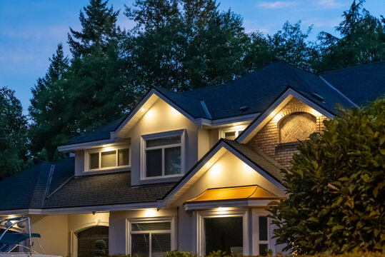 Top of luxury house with nice green Summer landscape at night in Vancouver, Canada, North America. August 2025.