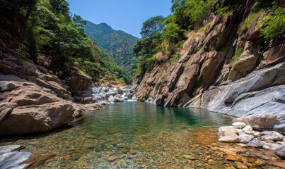 Scenic view of a clear, turquoise pool nestled between rocky cliffs with lush foliage
