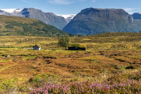 idyllic mountain landscape with cottages in the Breimsbygda hiking area high above the Innvikfjorden and Breimsvatnet Lake