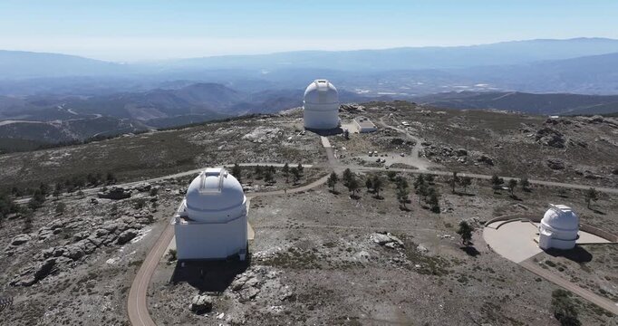 Calar Alto Observatory Spain aerial wide view of telescope domes and scientific complex on mountain plateau with remote highland landscape