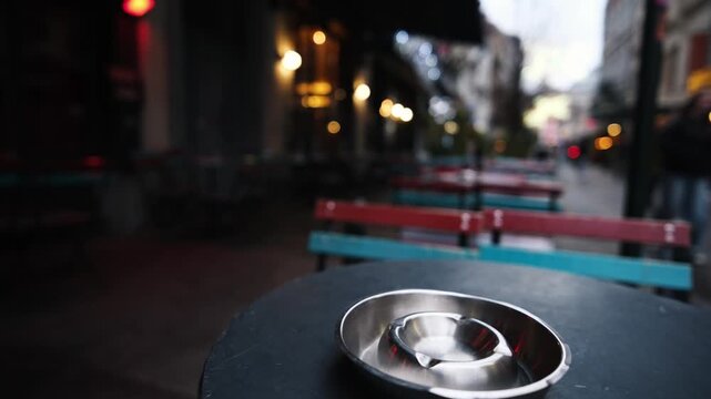 Cigarette Ashtray On Outdoor Cafe Table, Smoking In Public Places