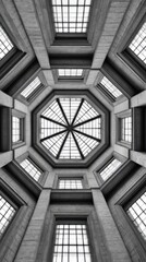 Naklejka premium A grand interior atrium with a glass octagonal skylight, stone arches, and precise geometric symmetry Balanced