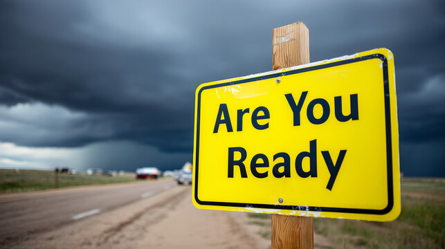 Warning sign asking "Are You Ready" with stormy background, disaster preparedness message, emergency readiness concept, severe weather alert, crisis preparation, safety awareness,