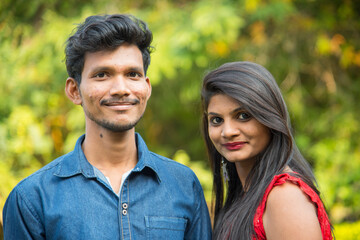 Fototapeta premium Portrait of happy brother and sister at outdoor