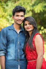 Fototapeta premium Portrait of happy brother and sister at outdoor