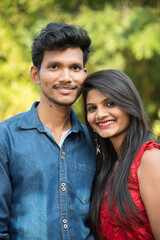 Fototapeta premium Portrait of happy brother and sister at outdoor
