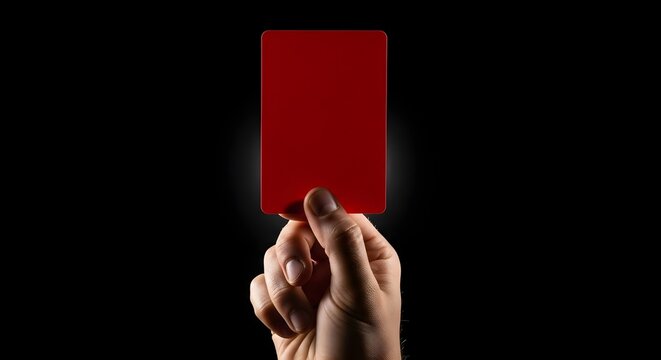 Referee Hand Holding Red Card for Penalty Send Off