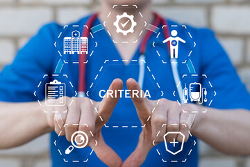 Fototapeta na wymiar Doctor using virtual touch screen presses the word CRITERIA. Criteria Controlling Follow Guidelines Conduct Concept. Criteria evaluation. Goal setting and achievement strategy.
