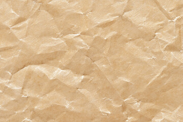 Obraz premium Textured wrinkled brown kraft paper background with natural fiber patterns and recycled material aesthetic.