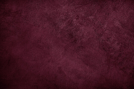 Black dark purple burgundy red wine plum texture background. Painted concrete wall surface. Grunge rough uneven plaster scratched damaged. Close-up. Empty blank template design ad.