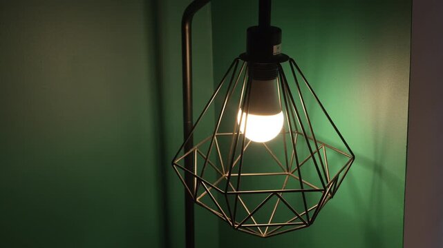 A deco corner lamp being turned on and off inside a room