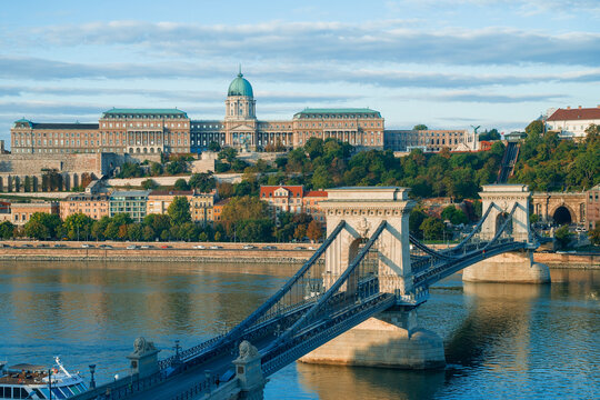 Szechenyi Chain Bridge and Buda Castle with autumn foliage at sunrise in Budapest, Hungary