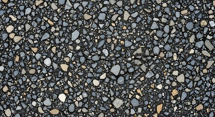 Obraz premium Close-up of asphalt surface showcasing its rough texture with colorful gravel and small stones