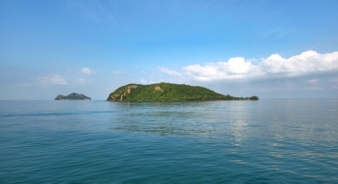 Tropical island Ko Tae Nai surrounded by calm blue ocean near Island Ko Pha-Ngan, Surat Thani, Thailand.