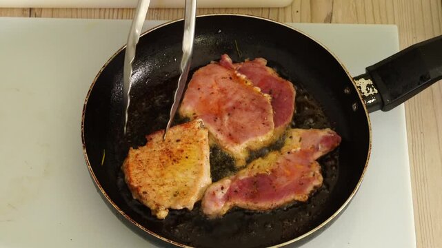 The process of cooking meat in a pan