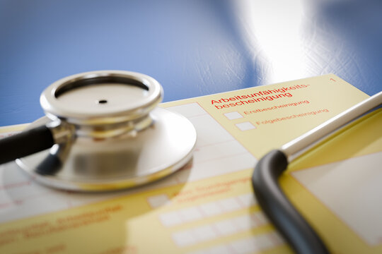 Closeup of a German certificate of incapacity for work (Arbeitsunf&auml;higkeitsbescheinigung - AUB) with a stethoscope. Shallow depth of field