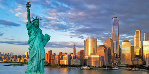 Liberty statue near New York City harbor, America. New York City waterfront and Liberty statue. Statue of Liberty in New York City. Skyline of NYC and Liberty statue. © Volodymyr