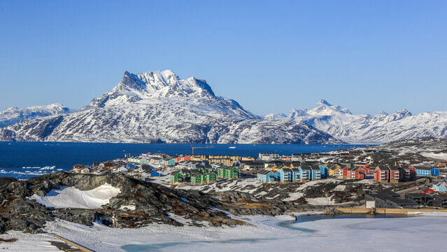 Greenlandic capital city suburb colorful landscape, with fjord and Sermitsiaq mountain in the background, Nuuk , Greenland