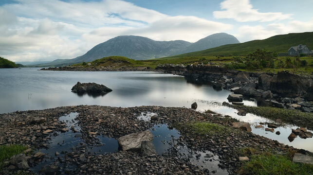 Tranquil Landscape of Lough Inagh in Connemara Valley with Reflection of Twelve Bens Mountains on Still Water in County Galway Ireland, scenic travel adventure, background