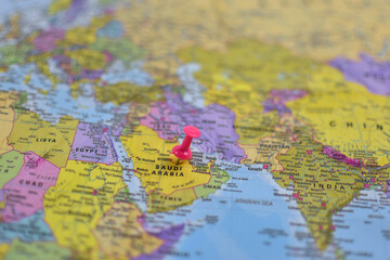 Middle East political map with pink pushpin marking Saudi Arabia, surrounded by labeled countries including Egypt, Iran, Iraq, and Turkey.