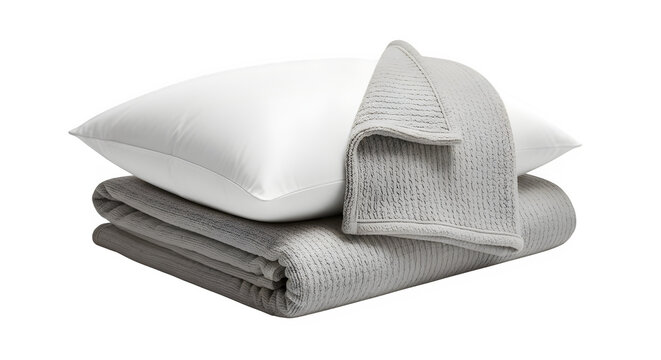 Stack of soft gray knitted blanket and fluffy white pillow for bedding display isolated on transparent background