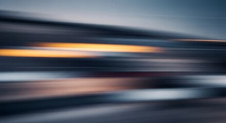 Blurry abstract image with streaks of orange and blue