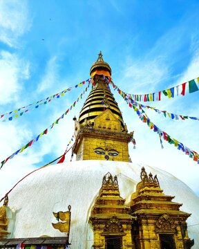 The Ancient Swayambhunath Stupa with Buddha Eyes and Prayer Flags Surrounded by Stone Chaityas, Kathmandu, Nepal