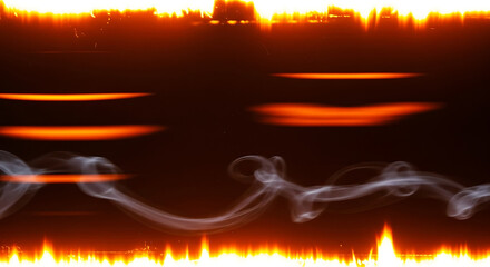 Abstract blurred image of fiery orange and yellow lights on dark background