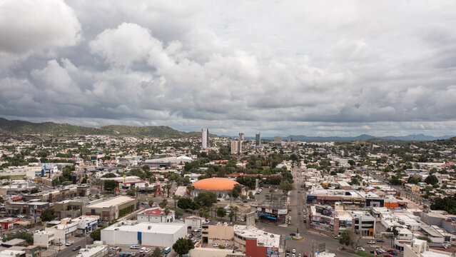 Aerial panoramic view of Hermosillo, Sonora with a cloudy sky as background.
