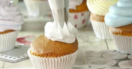 Hands Piping Sweet Buttercream, Artistic Process Illustrating Detailed Cupcake Decorating Techniques