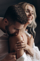 Couple sharing a moment inside a studio during an evening setup